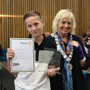 Image: Jack Glover receives award from Chris Davies of Rotar