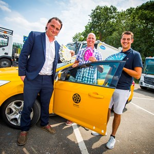 Image: Cllr Clarke, Jeff and Joe Boulton with a council fleet vehicle and Sam Says stickers