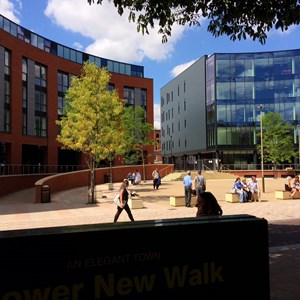 New Walk Place development buildings people trees sunshine