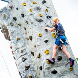 child on climbing wall