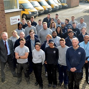Image: City mayor Peter Soulsby with apprentices and former apprentices at the city council's housing depot