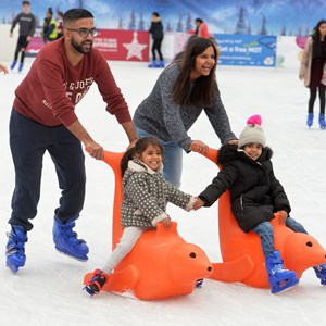 family on ice rink