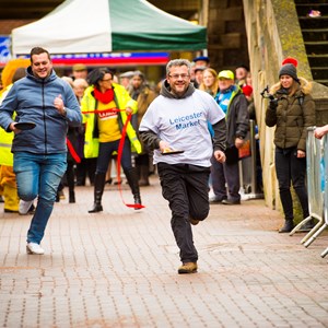 Image: Participants in the 2018 pancake race at Leicester Market