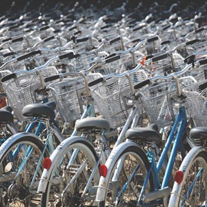 Many bikes parked together