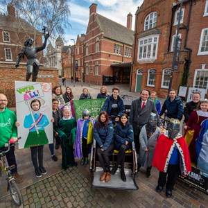 Image: Picture shows members of the Greyfriars Open Streets initiative with Cllr Adam Clarke (red tie). They are pictured with some of the activities that will be available at Open Streets (bike polo, rickshaw rides) and children from school on a visit to the nearby KRIII Visitor Centre.