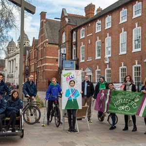 Image: The Greyfriars Open Streets event for April will have a Suffragette theme. Picture shows the Greyfriars area with council staff and partners posing with bikes and Suffragette banners.