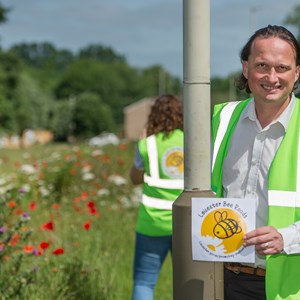 Cllr Adam Clarke with the wildflower-filled Bee Roads