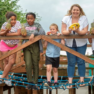 Image: Cllr Sarah Russell with children at Woodgate Adventure Playground in Leicester