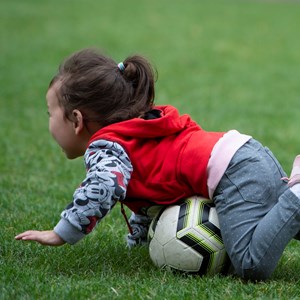 child having fun with ball