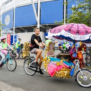 Image shows 2018's Let's Ride Leicester event - cyclists going past the King Power Stadium