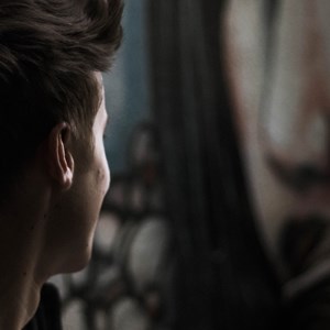 Face of young person in shadow