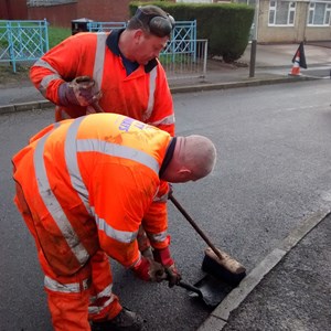 Highways staff repairing potholes