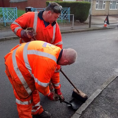 Highways staff repairing potholes