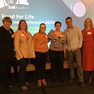 Image shows Jody Gemmell with other school and catering staff, Food for Life staff and Hugh Fearnley Whittingstall