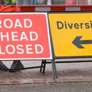 Signs showing road closed and diversion route