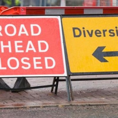 Road closed and diversion sings