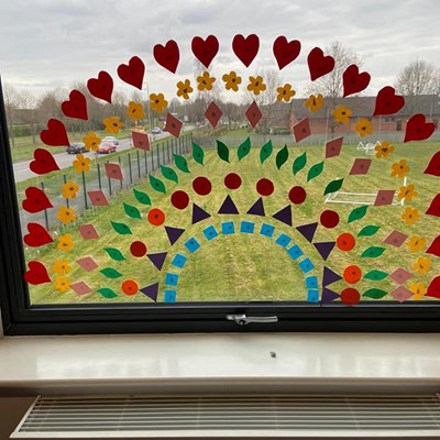 Image: A rainbow artwork in a school window