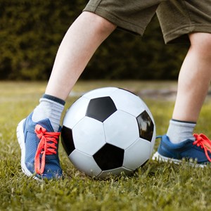 Boy playing with football