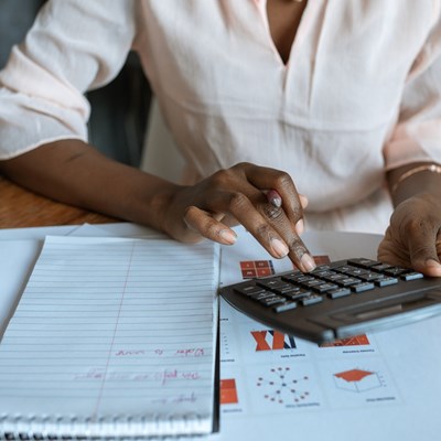 Woman using calculator for family bills