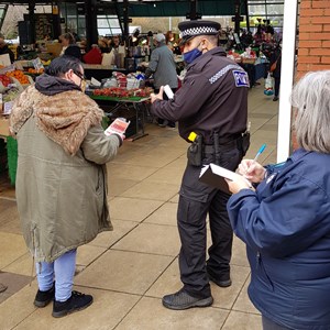Council staff and police talking to shoppers