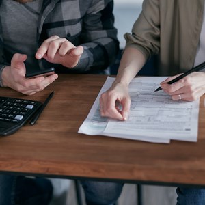 People calculating finances