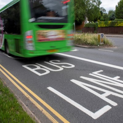 A picture of a bus in bus lane