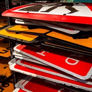 Stack of roadsigns in a depot
