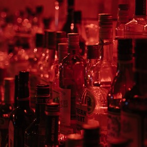 Close up of rows of bottles of alcohol