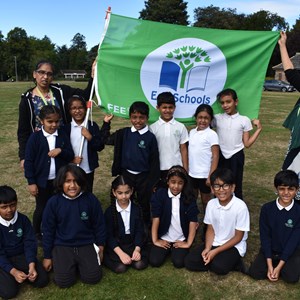 Abbey Mead Primary Academy pupils and staff with their Eco-Schools Green Flag