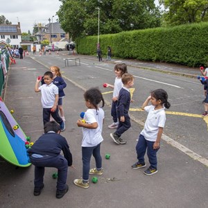 Pupils playing in road outside St Thomas More on Clean Air Day in June 2021