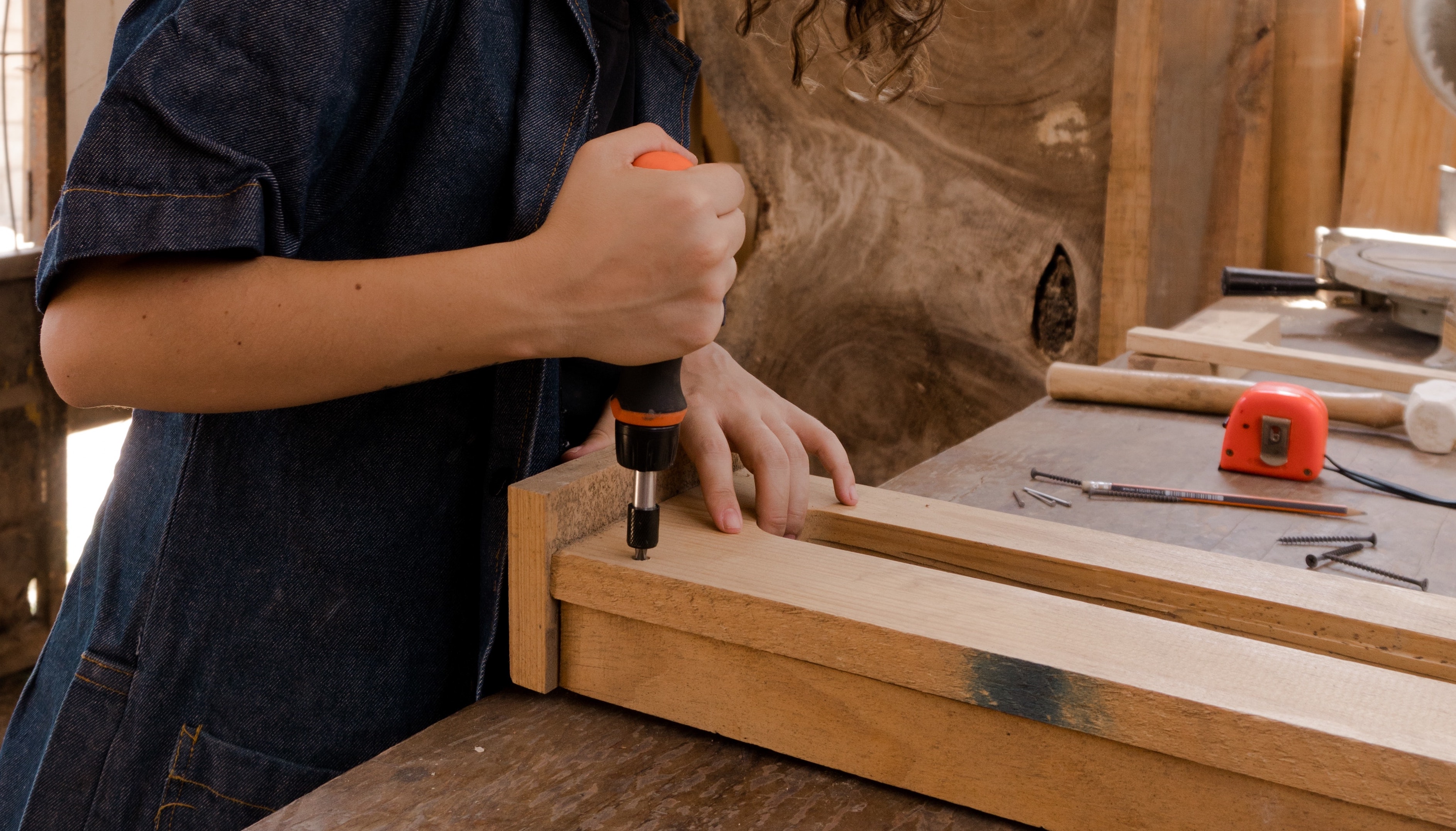 woman using carpentry tool