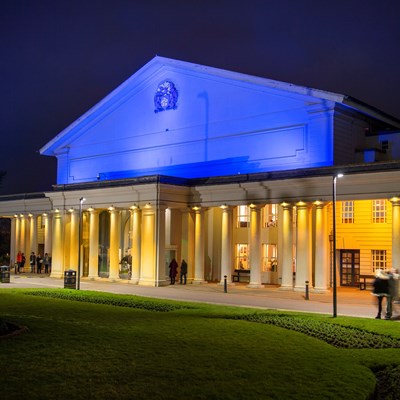 De Montfort Hall in Leicester, lit up in the blue and yellow of the Ukrainian flag