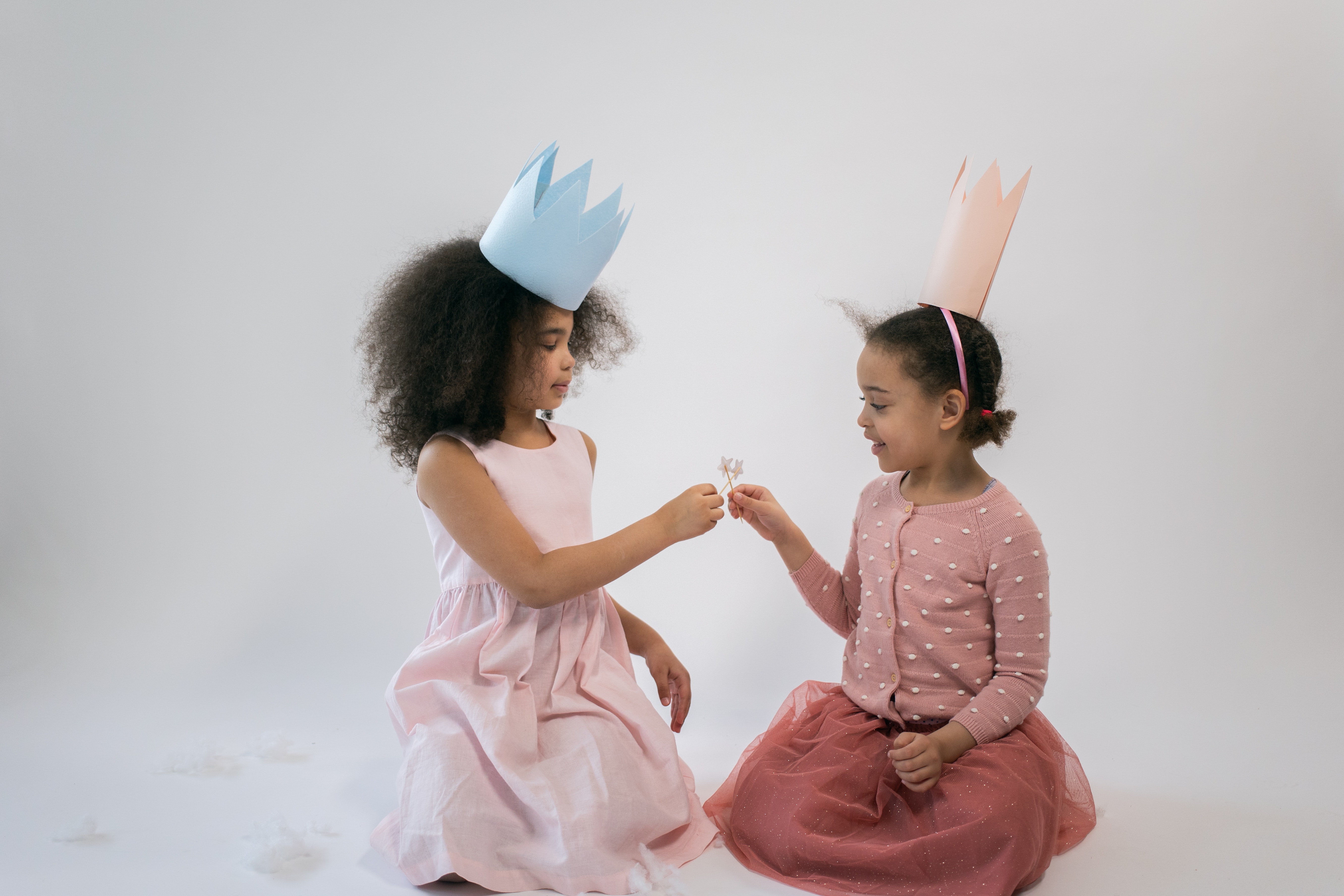 Young girls wearing homemade crowns