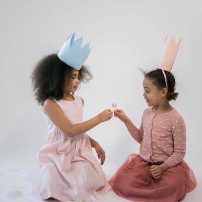 Young girls wearing homemade crowns