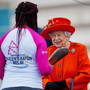 The Queen launches the relay by handing the Baton to Kadeena Cox