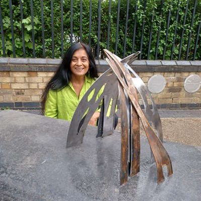 Artist Anuradha Patel with a model of her winning submission, ‘Structural Gateway’.
