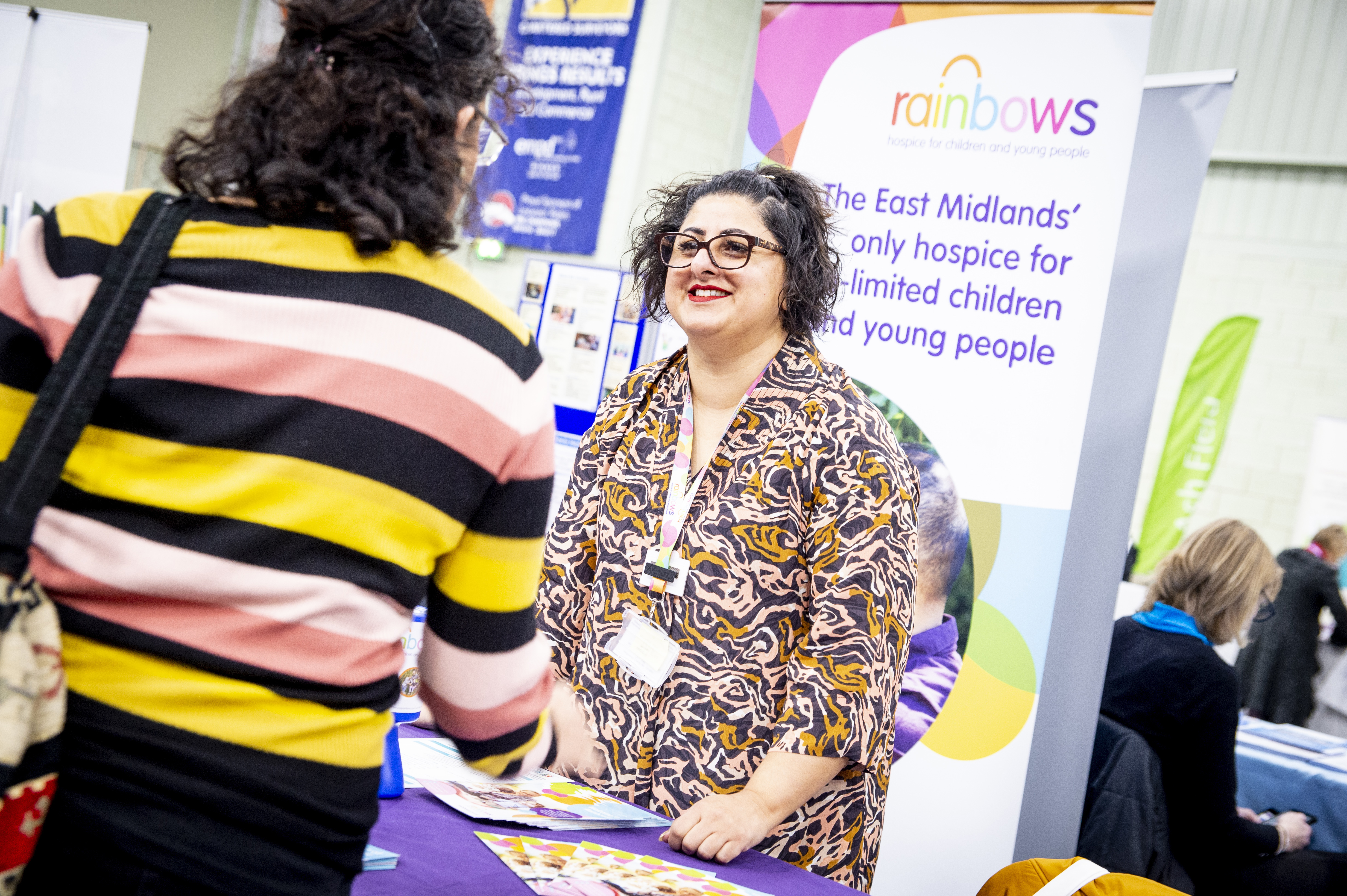A picture of a visitor talking to a stallholder at a previous Local Offer Live event