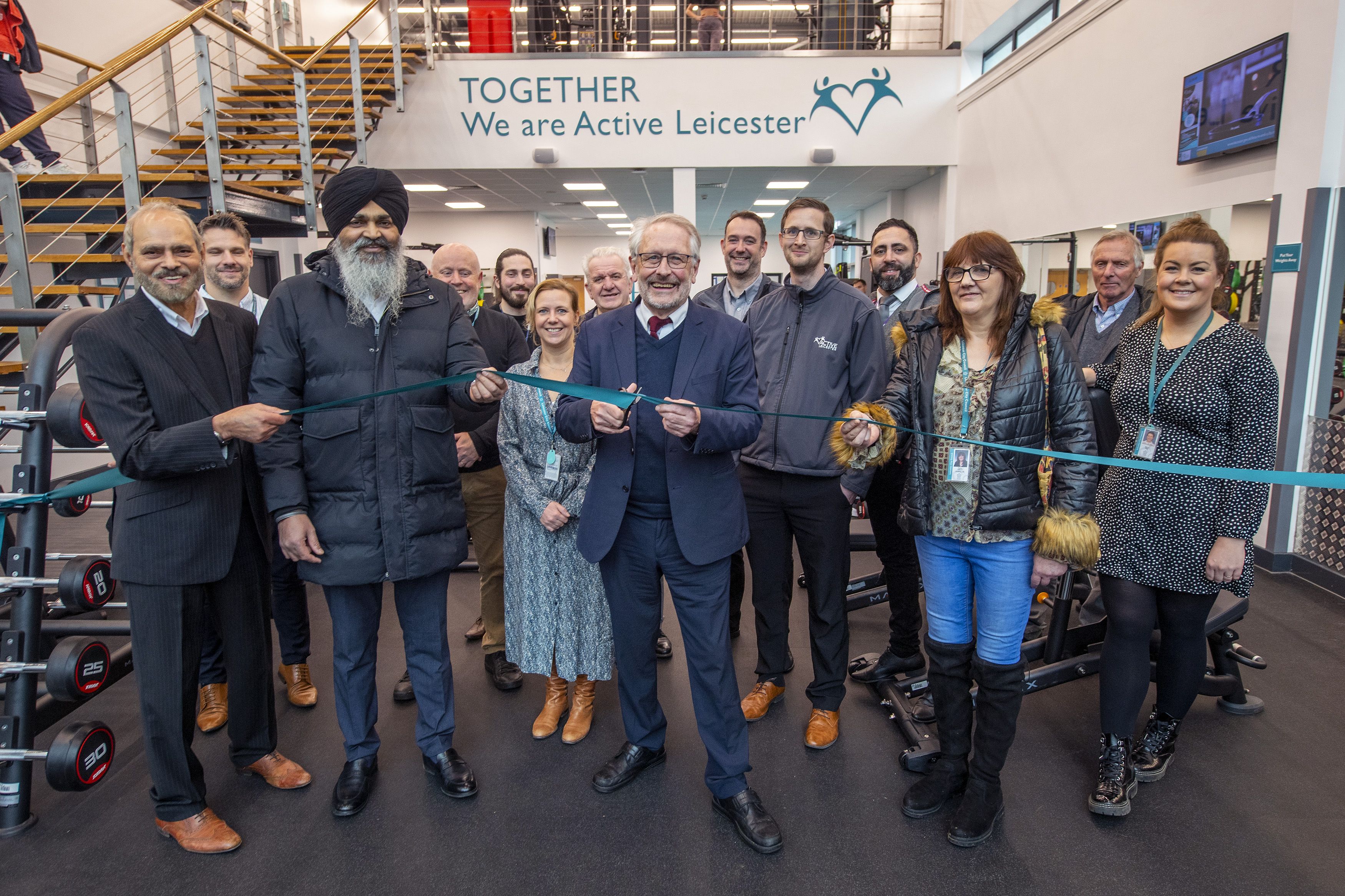 Cutting the ribbon at the reopening of the gym