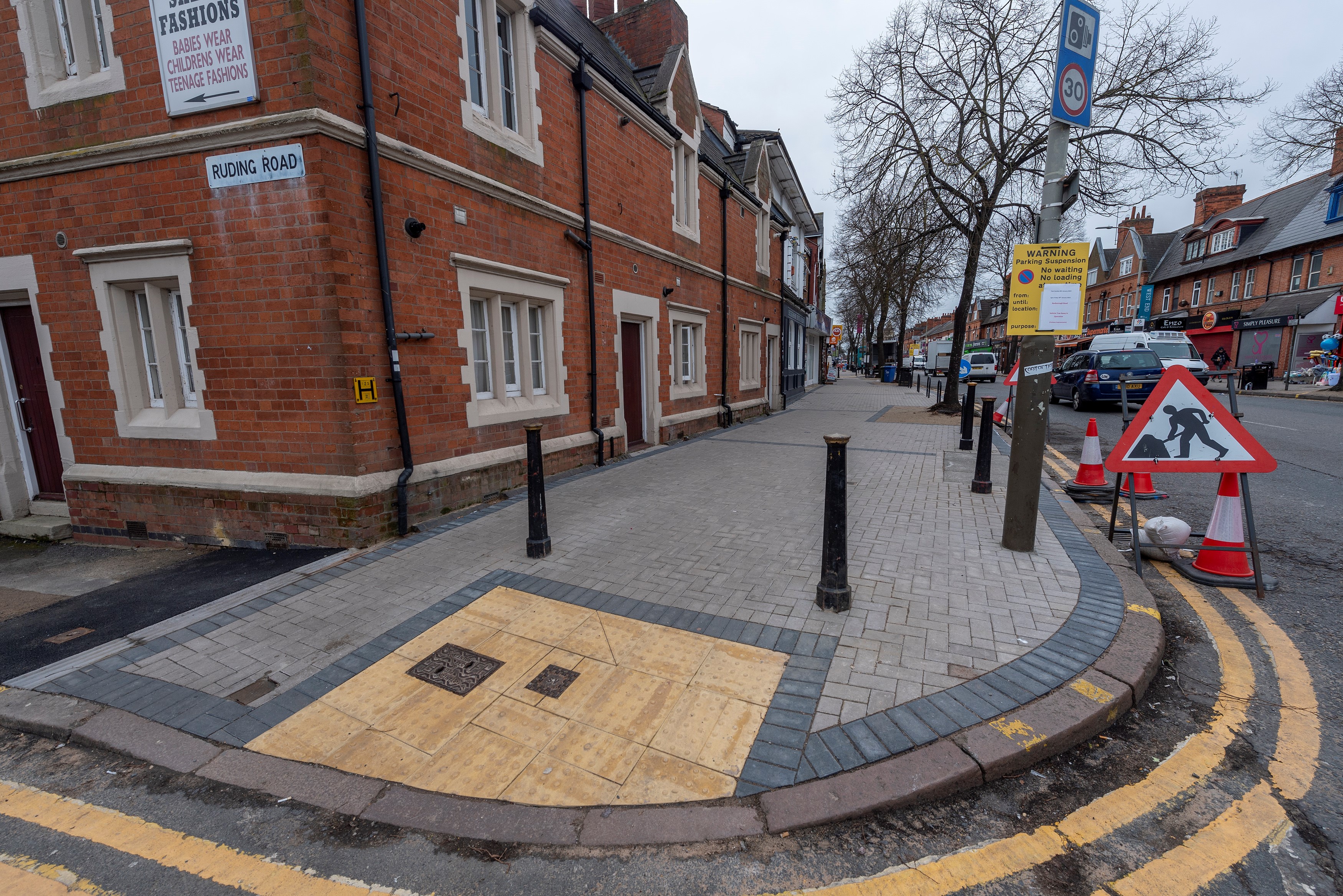 Bollards and new paving at the corner of Ruding Road