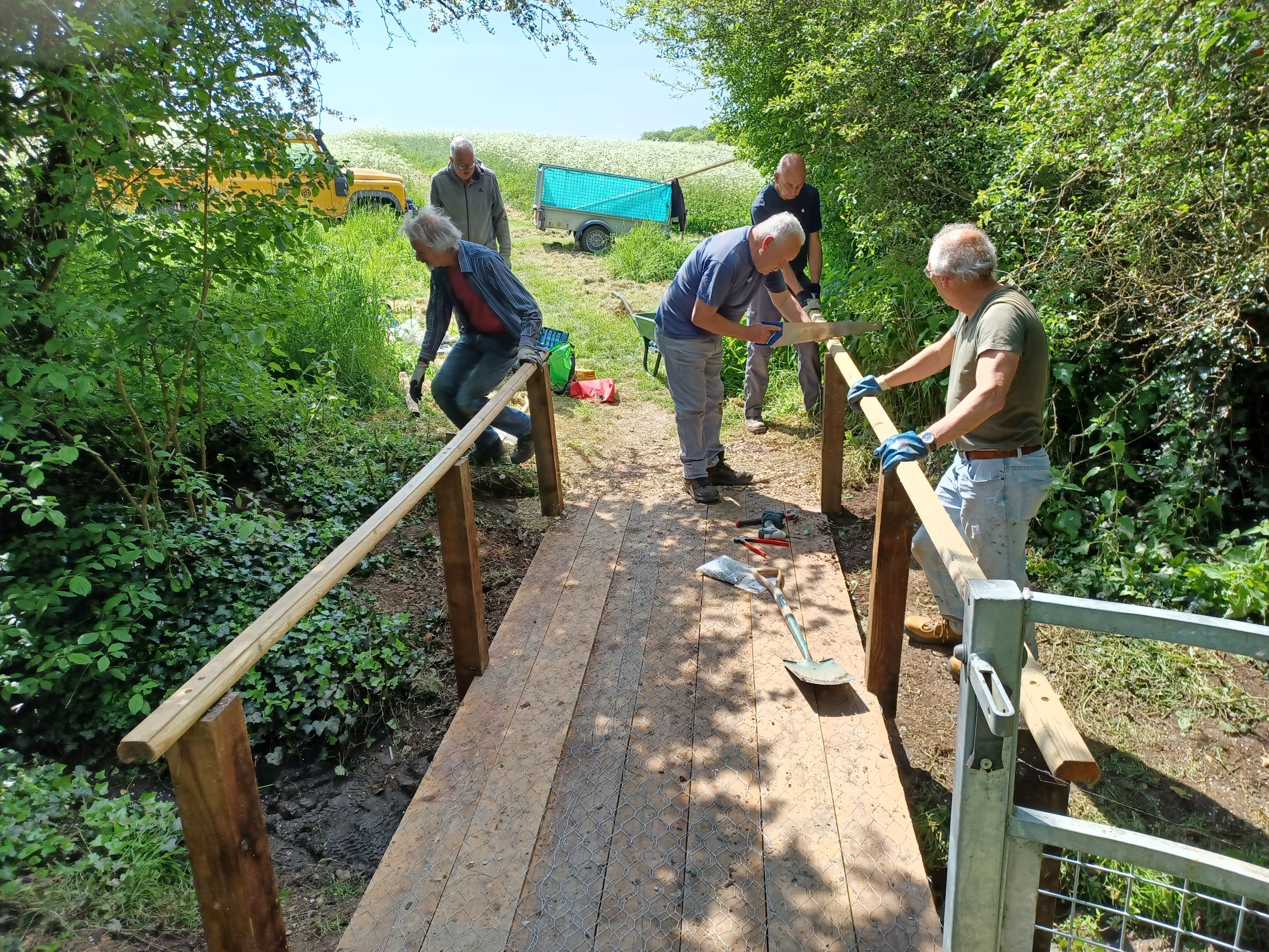 Local volunteers working on a footbridge