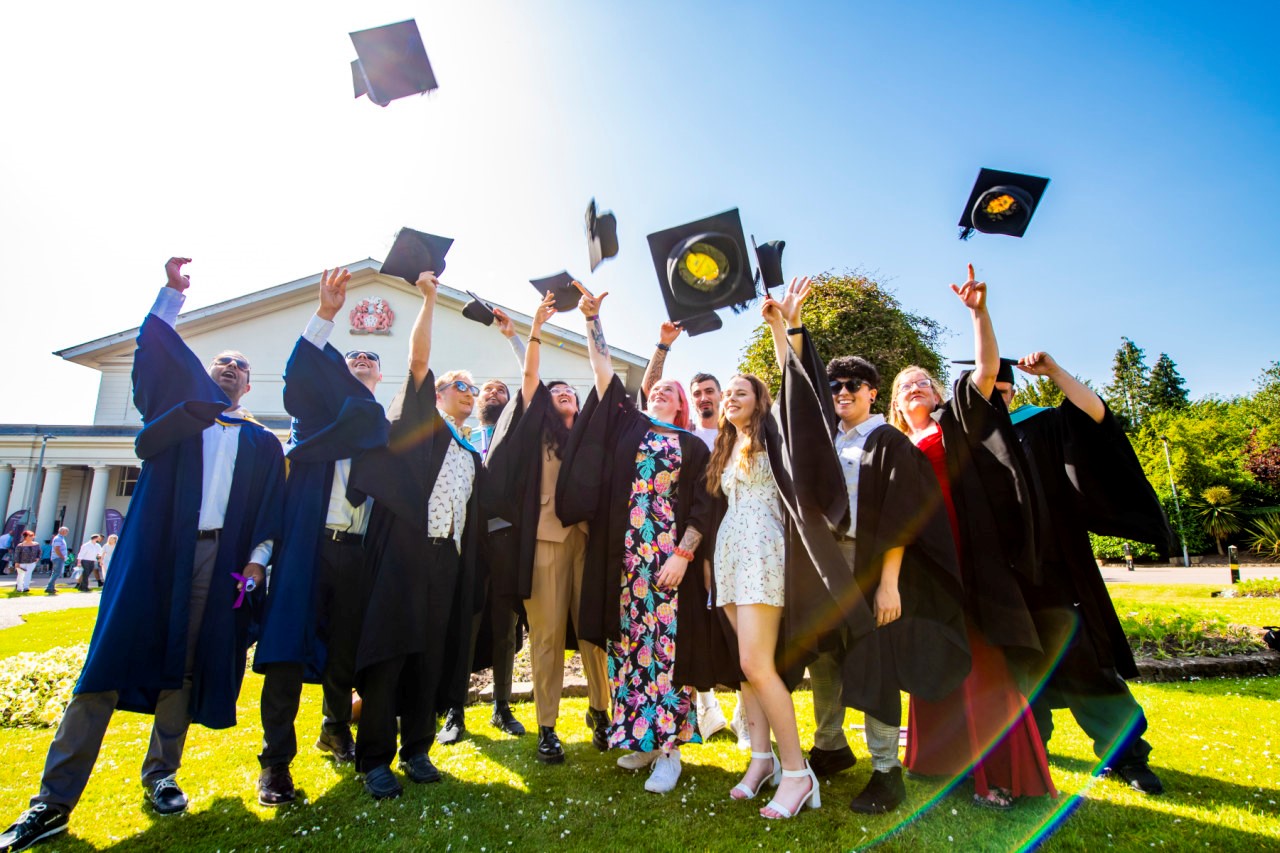 Previous apprentices celebrating outside De Montfort Hall