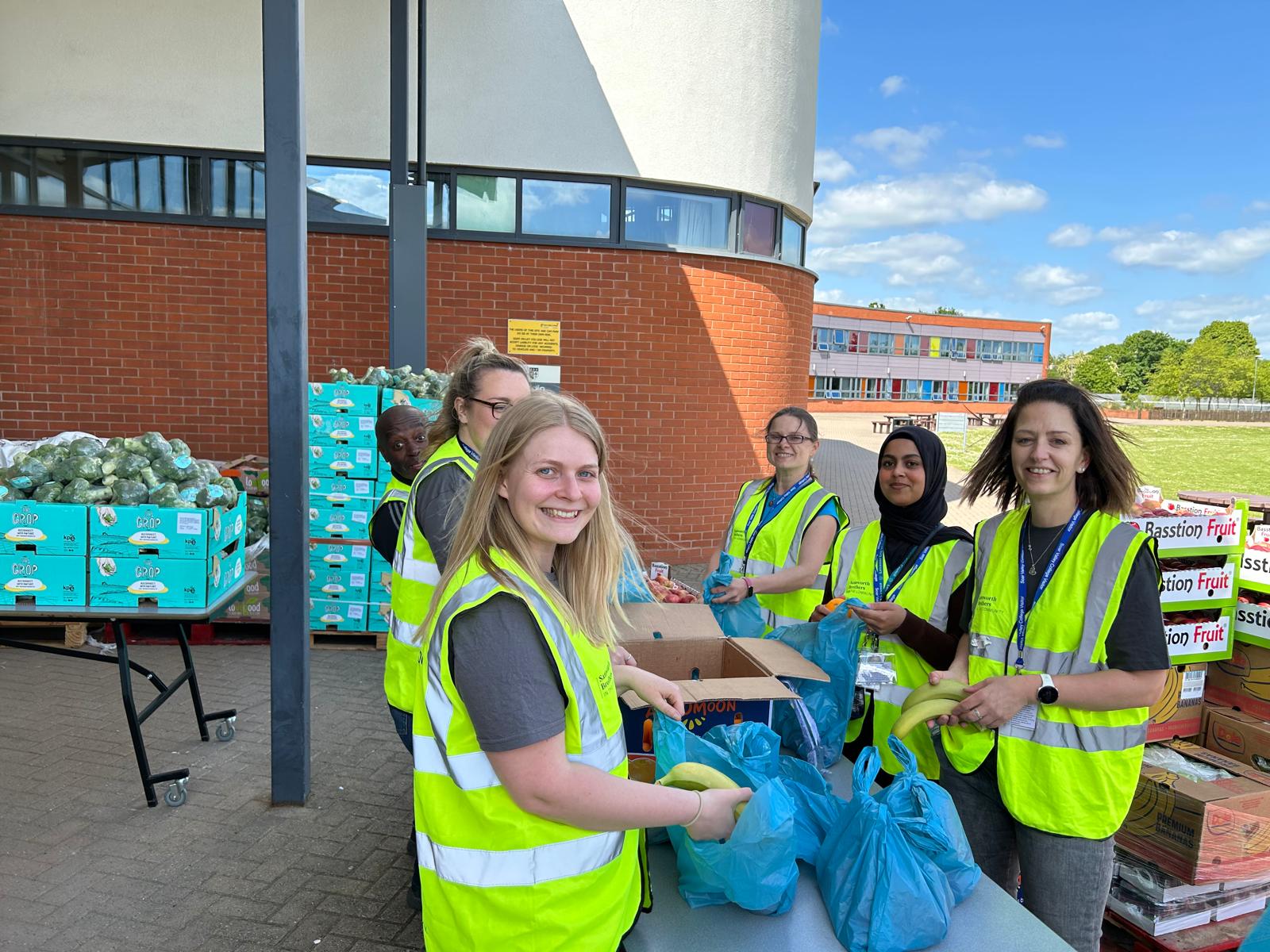 Staff and volunteers at a pop-up pantry in May 2023