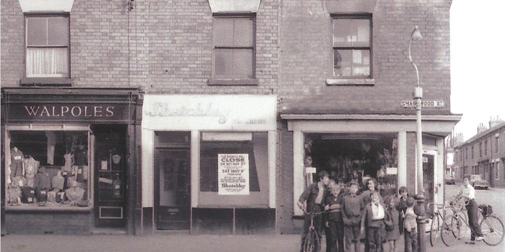 Archive image of children outside shops on Charnwood Street