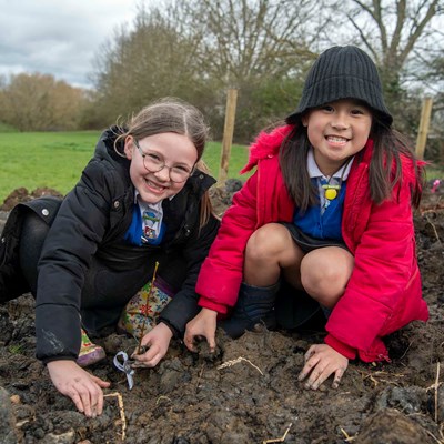Pupils helping to plant the new Tiny Forest