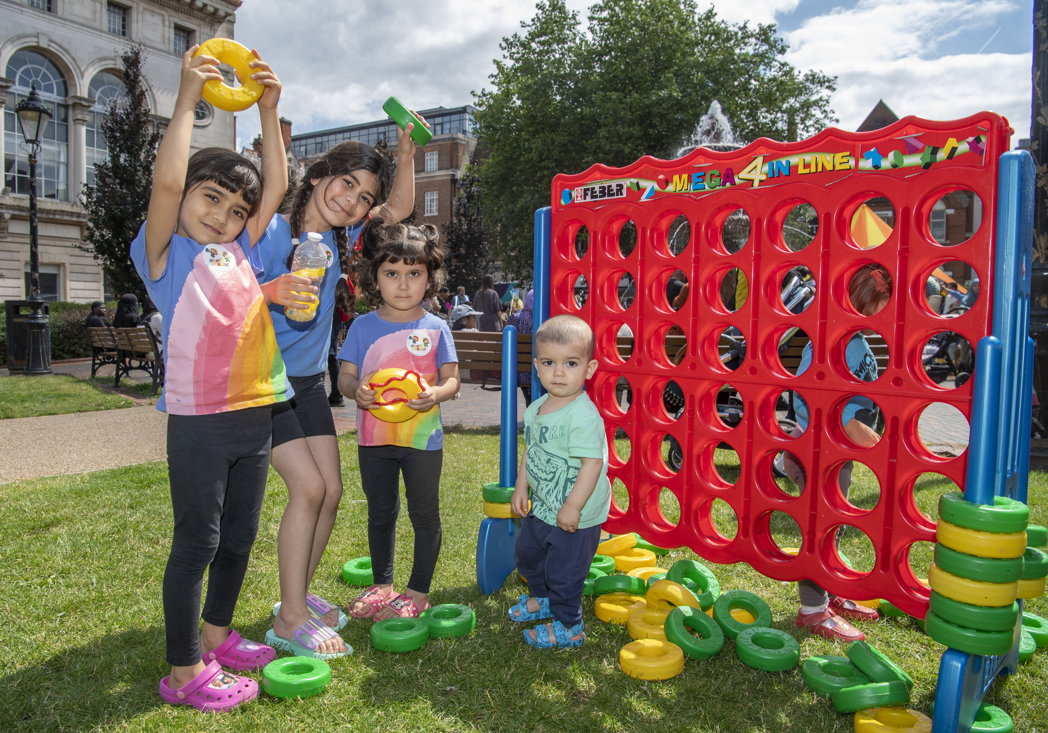 Children playing giant games at a playday in Leicester