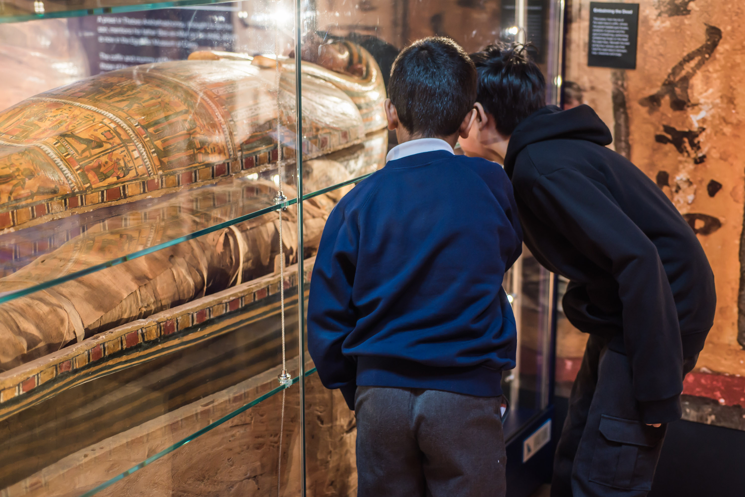 Children examine exhibits in Leicester's Ancient Egypt gallery