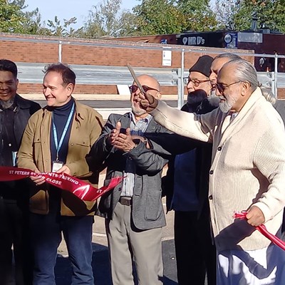 Ward councillors, housing staff and local people cut a ribbon at the new Jupiter Close parking spaces site