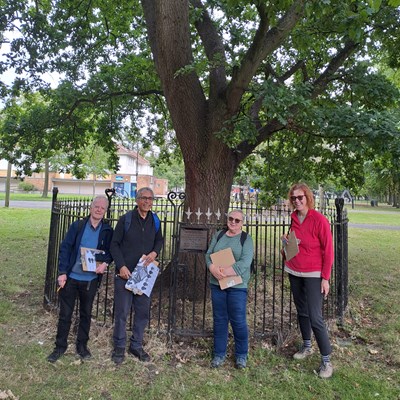 Leicester's tree wardens with the oak tree that was planted in 1946 to mark the visit of the King and Queen.