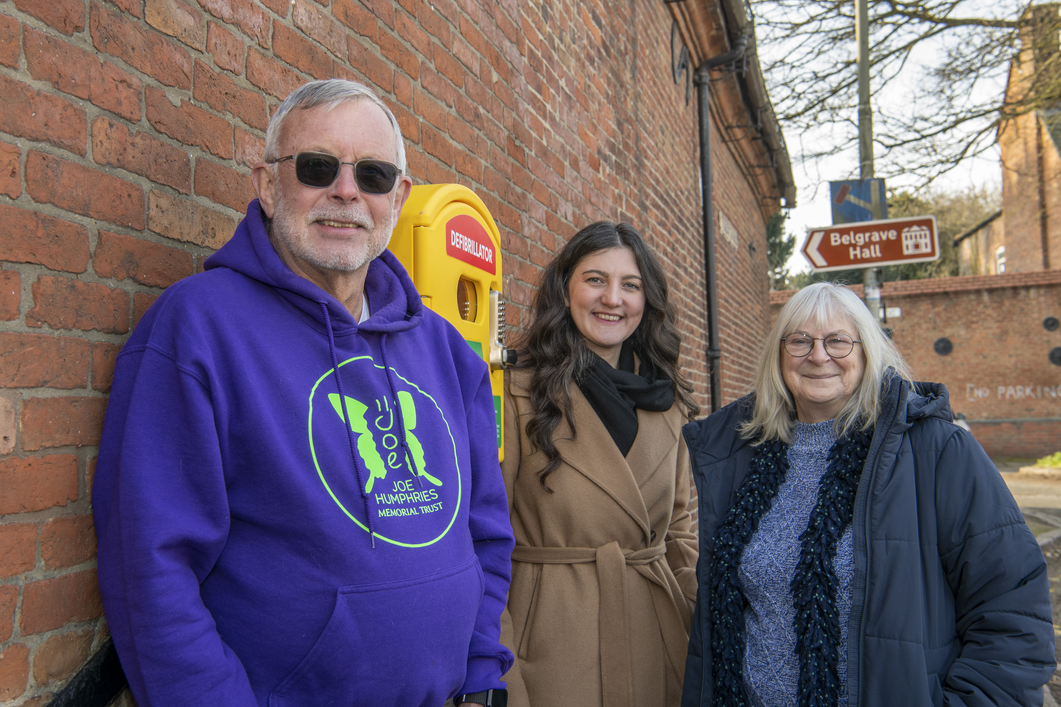 Picture shows l-r Dr Mike Ferguson, Dr Laura French and Cllr Vi Dempster with the new defibrillator