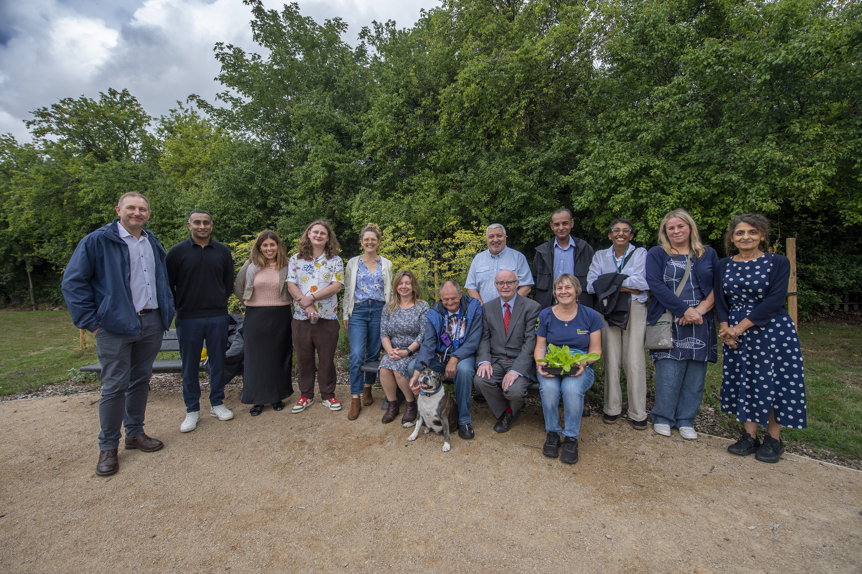 Community members, councillors and council staff at Meadow Gardens community garden